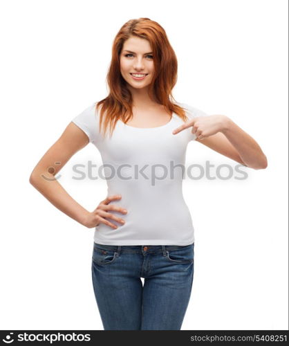 t-shirt design concept - smiling teenager in blank white t-shirt pointing her finger at herself