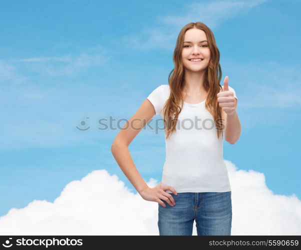 t-shirt design concept - smiling teenager in blank white t-shirt showing thumbs up