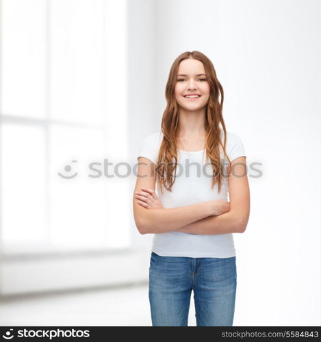 t-shirt design concept - smiling teenager in blank white t-shirt with crossed arms