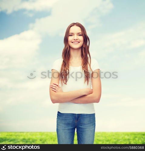 t-shirt design concept - smiling teenager in blank white t-shirt with crossed arms