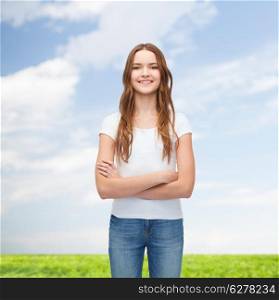 t-shirt design concept - smiling teenager in blank white t-shirt with crossed arms