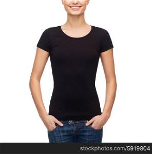 t-shirt design concept - smiling woman in blank black t-shirt. smiling woman in blank black t-shirt