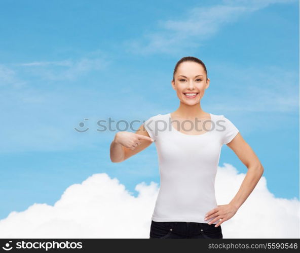 t-shirt design concept - smiling woman in blank white t-shirt pointing at herself