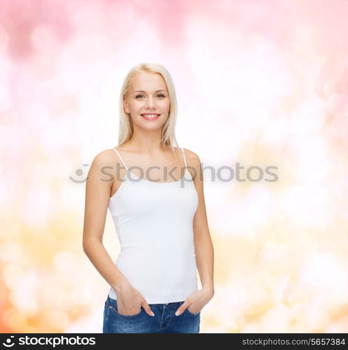 t-shirt design concept - smiling woman in blank white tank top