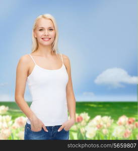 t-shirt design concept - smiling woman in blank white tank top