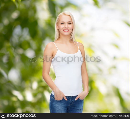 t-shirt design concept - smiling woman in blank white tank top