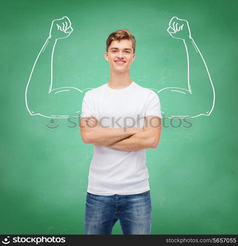 t-shirt design, education, school, advertising and people concept - smiling young man in blank white t-shirt over green board background strong arms drawing