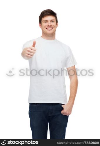 t-shirt design, gesture and people concept - smiling young man in blank white t-shirt showing thumbs up