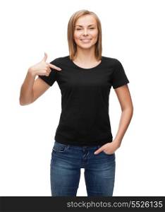 t-shirt design, happy people concept - smiling woman in blank black t-shirt pointing her finger at herself