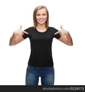 t-shirt design, happy people concept - smiling woman in blank black t-shirt pointing her fingers at herself