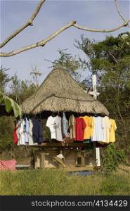 T-shirts hanging on a stall, Jonesville, Roatan, Bay Islands, Honduras