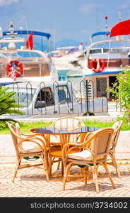 table against the background of the yacht harbor