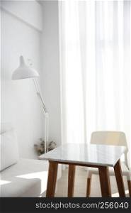 table and chair with white lamp