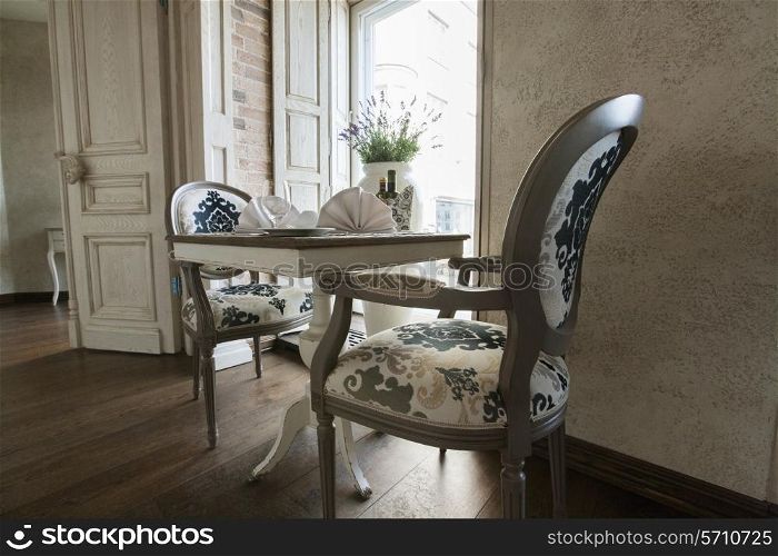 Table and chairs arranged in restaurant