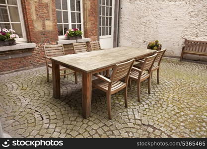 Table and chairs in patio, vintage style&#xA;