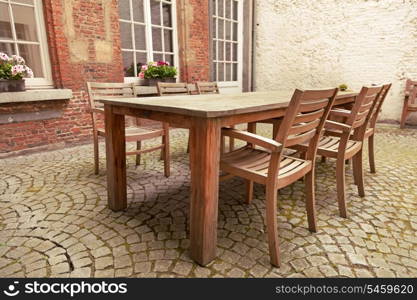 Table and chairs in patio, vintage style&#xA;