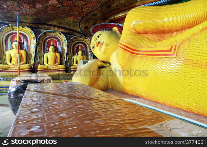 Table and sleeping Buddha in Mulkirigala cave, Sri Lanka