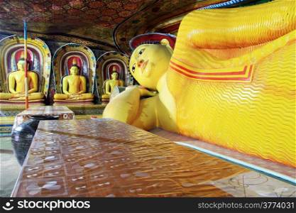 Table and sleeping Buddha in Mulkirigala cave, Sri Lanka