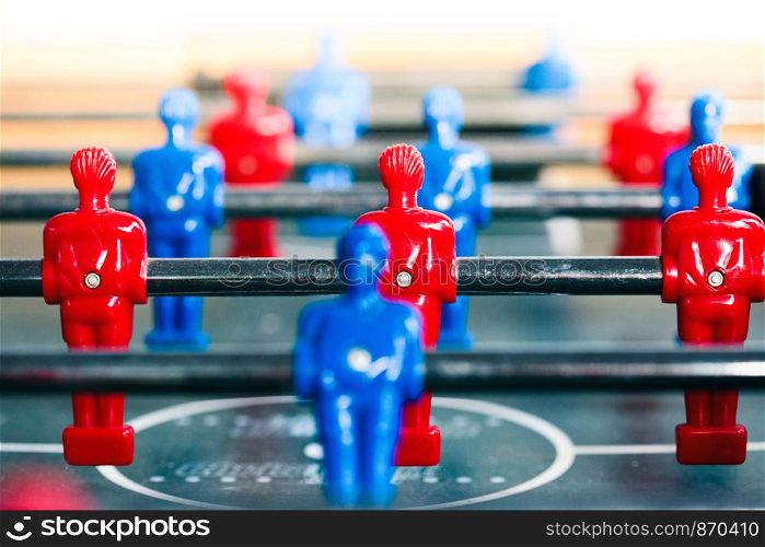Table football game sport competition two competitors players on field. Closeup of players