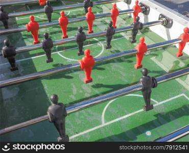 Table football. Table football aka table soccer, foosball from the German Tischfussball, baby-foot or kicker table-top game and sport