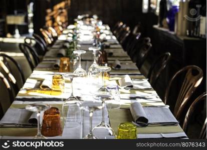 Table in an Italian restaurant. Wooden antique furniture