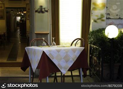 Table in an Italian restaurant. Wooden antique furniture