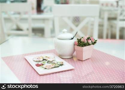 Table in confectionery. Close up pink table