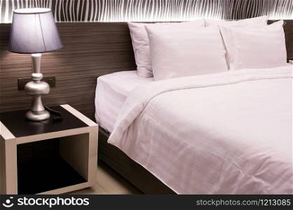 table lamp with bedroom at hotel room