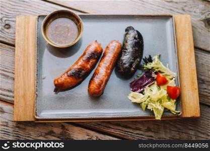 Table of chorizos and Spanish blood sausages in a restaurant
