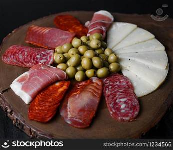 table of fresh sausages with stuffed olives