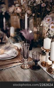 Table setting decorations, glasses and plates. Holidays, catering and hospitality concept.. Table setting decorations, glasses and plates.