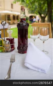 Table setting with bottle of wine in restaurant