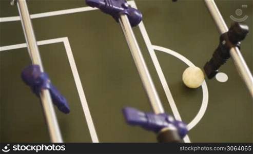 table soccer - a penalty shot is given and makes a goal, Tischfussball, Kicker - ein Strafsto? oder Elfmeter wird ausgefuhrt - Tor