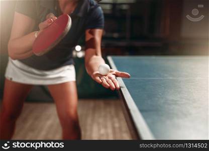 Table tennis, female player with racket and ball. Ping pong training indoor, high concentration sport game. Table tennis, female player with racket and ball