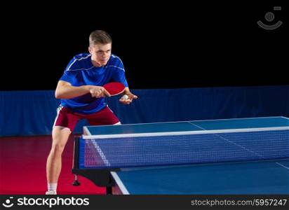 Table tennis player isolated on black