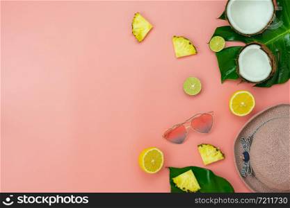 Table top view accessory of clothing women plan to travel in summer holiday background concept.monstera leaves with essential items sunglasses & slippers on modern rustic pink paper.Space for design.