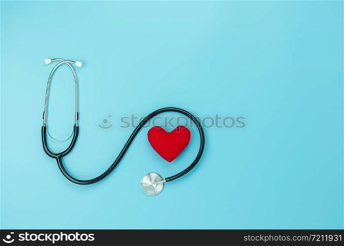 Table top view aerial image of accessories healthcare & medical with Valentines day background concept.telescope with colorful heart shape on blue paper.Flat lay items for doctor using treat patient.