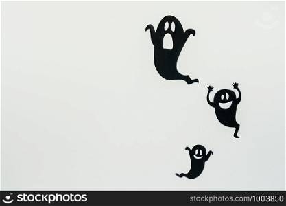 Table top view aerial image of decoration Happy Halloween day background concept.Flat lay accessories essential object to party the black ghost on rustic white stone.Space for creative design text.