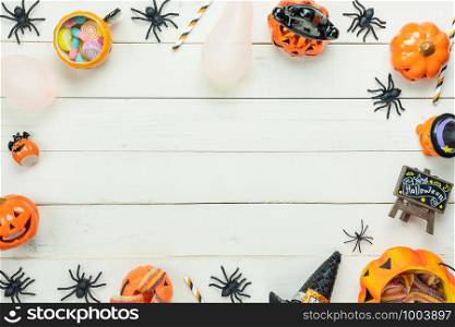Table top view aerial image of decoration Happy Halloween day background concept.Flat lay accessories essential object to party the pumpkin & balloon on white wooden.Space for creative design text.