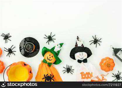 Table top view aerial image of decoration Happy Halloween day background concept.Flat lay accessories essential object to party the pumpkin & cute doll on white wooden.Space for creative design.