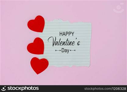 Table top view aerial image of decoration valentine&rsquo;s day holiday background concept.Flat lay arrangement of word season tag & essential items love heart on modern rustic pink paper for mock up.