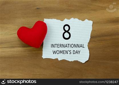 Table top view aerial image of decorations for international women&rsquo;s day holiday concept background.Flat lay sign of season the word 8 march happy woman&rsquo;s day card with heart shape on wooden plank.