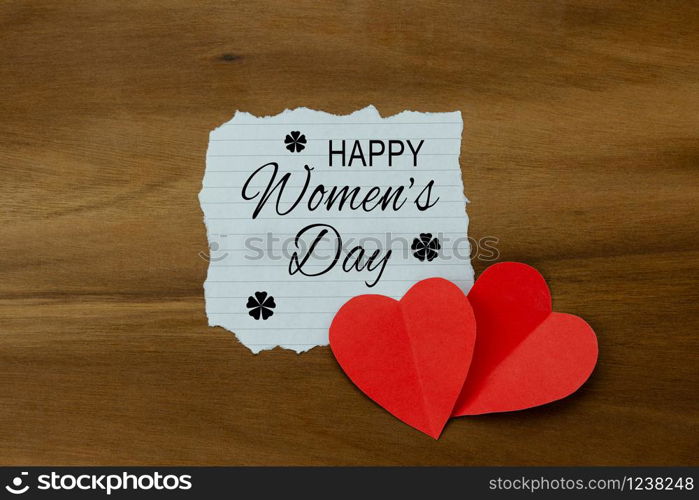 Table top view aerial image of decorations for international women&rsquo;s day holiday concept background.Flat lay sign of season the word 8 march happy woman&rsquo;s day with heart shape on wood plank.