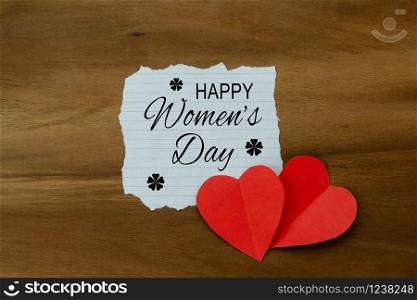 Table top view aerial image of decorations for international women&rsquo;s day holiday concept background.Flat lay sign of season the word 8 march happy woman&rsquo;s day with heart shape on wood plank.