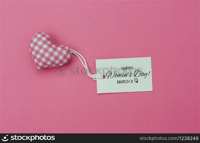 Table top view aerial image of decorations for international women&rsquo;s day holiday concept background.Flat lay sign of season the word 8 march happy woman&rsquo;s day card with heart shape on pink paper.