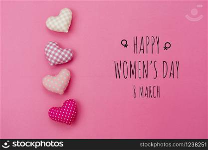 Table top view aerial image of decorations for international women&rsquo;s day holiday concept background.Flat lay sign of season the word 8 march happy woman&rsquo;s day with heart shape on pink paper.