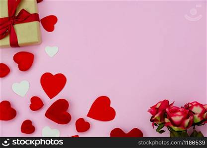 Table top view aerial image of sign valentines day background concept.Flat lay arrangement colorful many heart shape on modern grunge pink paper at home office desk studio.Pastel tone design backdrop.