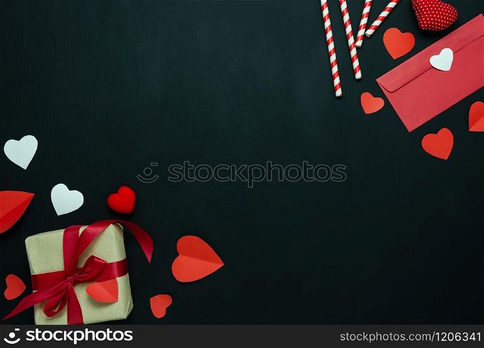 Table top view aerial image of sign valentines day background concept.Flat lay arrangement colorful many heart shape on modern grunge black wood at home office desk studio.Pastel tone design backdrop.