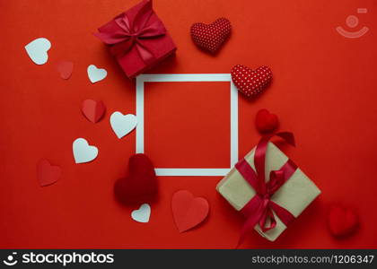 Table top view aerial image of sign valentines day background concept.Flat lay arrangement colorful many heart shape on modern grunge red paper at home office desk studio.Frame for design backdrop.