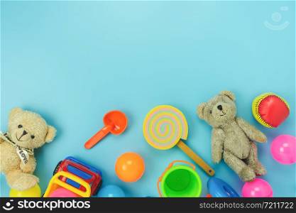 Table top view decoration kid toys for develop background concept.Flat lay accessories baby to play with items child on modern bule paper at office desk.Copy space for add text.pastel tone wallpaper.